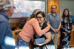 Southern Ute Council Member, Linda Baker gives a warm hug to Tribal Attorney, Julianne Begay who has been a key member of the Tribal Water Quality Standards (WQS) team and its success on Friday, April 15 in Council Chambers. 