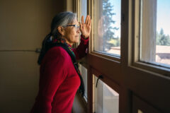 Southern Ute Council Member Linda Baker takes a moment from the former Head Start building tour to reflect on both the good and bad memories that were made in the historic Boarding School era building.   