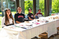 Elisia Cruz and Gabe Tuscon hold a bake sale and beadwork sale in the Hall of Warriors, Tuesday, July 12. All the money generated helps with college costs. Cruz and Tuscon will both be attending Bacone College. Bacone College is the nation’s oldest American Indian institution of higher learning and the oldest higher education institution in Oklahoma. 