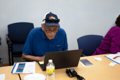 Marvin Cook reads instructions on how to prepare his computer, Tuesday June 14, at the Leonard C. Burch building. Tribal elders will utilize these computers for personal use, as well as accessing the new Tribal Member Experience portal.