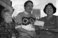 Sky Ute Casino donated money to help pay for a new paint job at the Native American Center on the Campus of Fort Lewis College in Durango, Colo. On behalf of the Native American Center, Renee Tree (right) accepts the monetary support from Casino Slot Operations Manager, Mark E. Torres and Administrative Assistant, Terrie Miller.  This photo first appeared in the September 20, 2002, edition of The Southern Ute Drum  