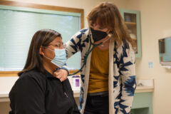 Dr. Erin Nealon DO, Pediatric Physician checks Tanisha Figueroa, SUHC Medical Assistant at the Southern Ute Health Clinic.  