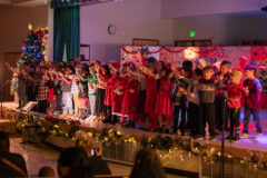 IES first graders sing various Christmas songs and perform dances on stage for their families during their Christmas program on Wednesday, Dec. 7. 
