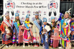 Southern Ute Royalty and Miss Indian World (2022) Tashina Red Hawk and Denver March Powwow Princess (2022) Tessa Holds the Enemy Abbey stand for a photo together at the Denver March Powwow in Denver, Colo., March 17-19.