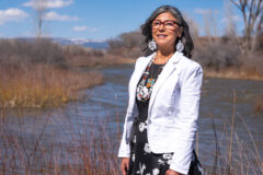 Lorelei Cloud, vice chair of the Southern Ute Indian Tribe, stands for a portrait April 17 on the banks of the Los Pinos River, also known as the Pine River, in the heart of the Southern Ute Reservation where water plays a critical role to the tribe. Strong winter snowpack results in higher-than-average water levels in the Pine River from Vallecito Reservoir to the north. 