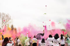 Participants simultaneously throw their colored powder in the air at the end of the run — in celebration of the community event.  