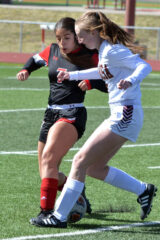 Ignacio’s Alexis Ortiz (7) steps in to battle for possession during non-league action Tuesday, April 25, against Alamosa. The first of four matches facing the Lady Bobcats during the week, IHS fell 6-1 to the Mean Moose.