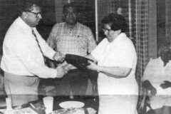 Reginald Spindler, Director of Colorado Health Service Unit, presented Edna Hood, outgoing chairwoman of the SUHB, with a plaque. Also pictured is Stanley Frost, coordinator for Southern Ute Health Service Unit and Ida William, board member.   This photo first appeared in the May 6, 1983, edition of the Southern Ute Drum.