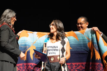 Southern Ute tribal member and SILDI graduate, Crystal Ivey receives a blanket along with her certificate from Vice Chairman Lorelei Cloud and Chairman Melvin J. Baker. Ivey was among the 10 Southern Ute tribal members to finish the SILDI program.   
