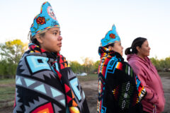 Southern Ute Royalty representatives, Miss Southern Ute Alternate, Rhianna Carel and sister, Junior Miss Southern Ute Alternate, Maleina Carel bundle up against the morning chill with Pendleton blankets ahead of the sunrise blessing at the Bear Dance campground, Thursday, May 25.  