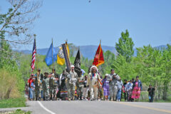 The Day of Remembrance procession, led by Raymond Baker (Navy – retired) and Terry Knight (USAF), followed by the Color Guard, near the Ouray Memorial Cemetery to close out the Memorial Day ceremony.