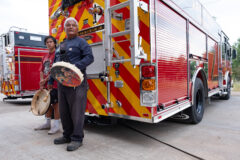 At the request of the Los Pinos Fire District and Deputy Chief of Operations, Jim Owens — Matthew Box and son, Noah Box performed a blessing on two fire engines recently brought into service for Los Pinos Fire District. Box explains the significance of a traditional blessing to the firefighters, prior to singing a Buffalo Song, Monday, Aug. 14.  