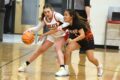 Thumbnail image of Ignacio junior Marissa Olguin (left) tries keeping the ball safely away from Montezuma-Cortez's Trenity Tillahash (5) during IHS' 58-44 home loss Thursday evening, Feb. 15. It was the last regular-season game for both teams; Olguin's 15 points paced IHS offensively.