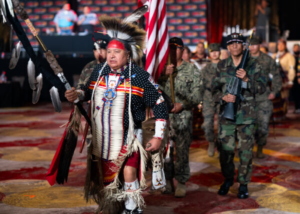Bruce LeClaire (U.S. Army), leads the Southern Ute Veterans Association in the Battle of the Guards, where the veterans payed homage to the point man as they bring their wounded back to safety. Bruce Valdez (U.S. Army) and Gordon Hammond (U.S. Marines), providing cover with reproduction M16 rifles during their color guard presentation.